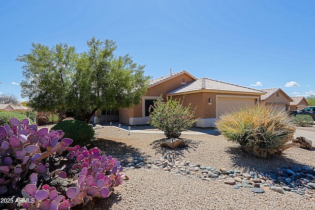 5049 E Duane Ln, Cave Creek, AZ 85331 - view of front facade with an attached garage, a tile roof, and stucco siding