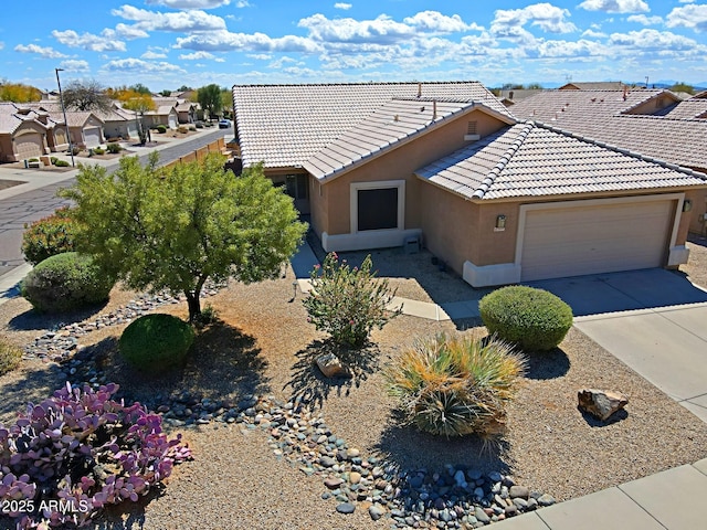 5049 E Duane Ln, Cave Creek, AZ 85331 - ranch-style home featuring a residential view, a garage, stucco siding, concrete driveway, and a tiled roof