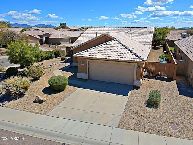 5049 E Duane Ln, Cave Creek, AZ 85331 - view of front facade featuring a tile roof, a residential view, a garage, concrete driveway, and stucco siding