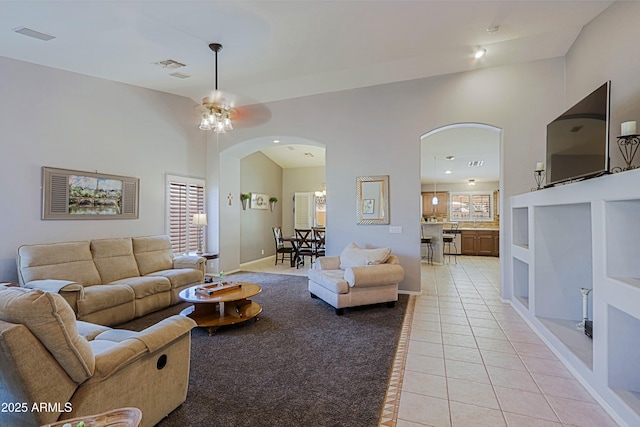 5049 E Duane Ln, Cave Creek, AZ 85331 - living room featuring arched walkways, a ceiling fan, baseboards, recessed lighting, and light tile patterned floors