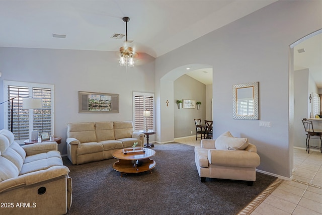5049 E Duane Ln, Cave Creek, AZ 85331 - living room featuring arched walkways, a ceiling fan, baseboards, light tile patterned floors, and visible vents