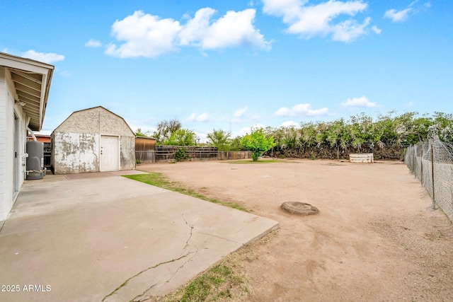 508 S Pasadena, Mesa, AZ 85210 - fenced backyard featuring an outdoor structure, a patio area, and a storage unit