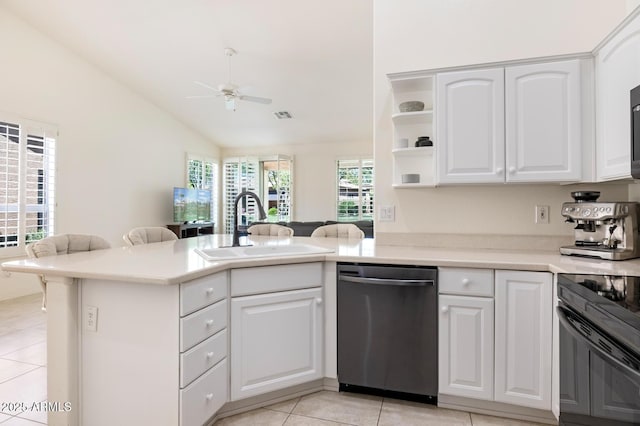 kitchen with visible vents, a sink, light tile patterned floors, dishwasher, and ceiling fan
