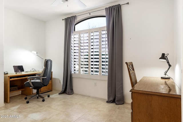 home office with light tile patterned floors, visible vents, and a ceiling fan