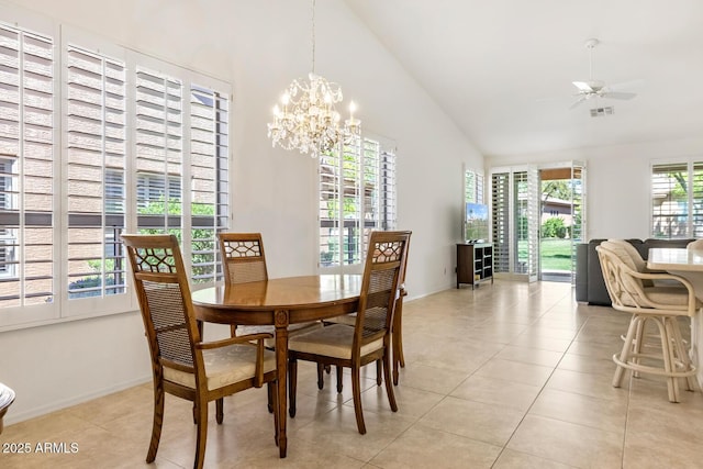 dining area with visible vents, high vaulted ceiling, light tile patterned flooring, and ceiling fan with notable chandelier