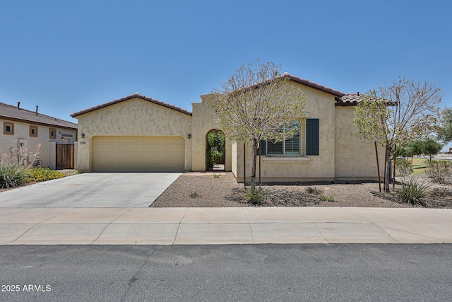 17082 S 182nd Ave, Goodyear, AZ 85338 - mediterranean / spanish house with a garage, stucco siding, concrete driveway, and a tile roof