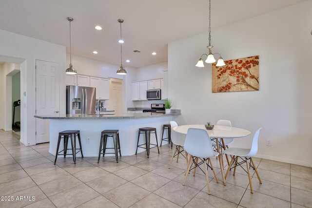 17082 S 182nd Ave, Goodyear, AZ 85338 - dining room featuring light tile patterned flooring and recessed lighting