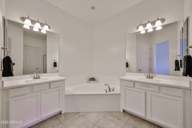 17082 S 182nd Ave, Goodyear, AZ 85338 - bathroom with two vanities, a garden tub, and tile patterned floors