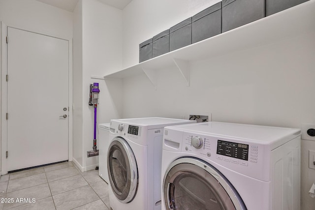 17082 S 182nd Ave, Goodyear, AZ 85338 - washroom featuring washing machine and clothes dryer and light tile patterned floors