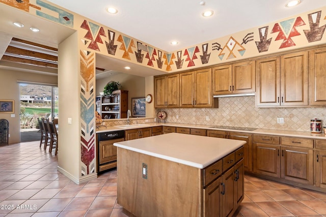 kitchen with sink, a center island, black electric cooktop, dishwashing machine, and decorative backsplash