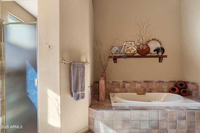 bathroom featuring tiled tub