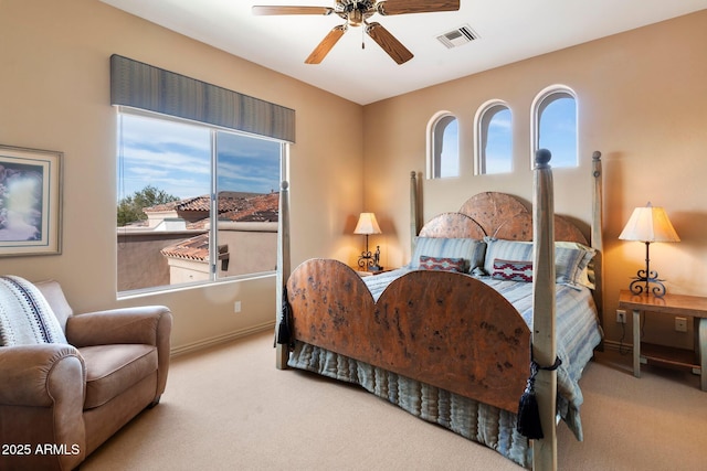 bedroom with light carpet and ceiling fan