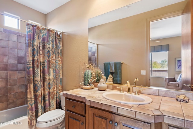 full bathroom with vanity, shower / tub combo with curtain, and toilet