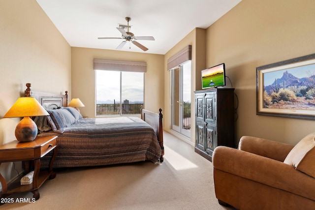 bedroom with light carpet, access to exterior, and ceiling fan