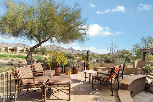 view of patio / terrace featuring a mountain view