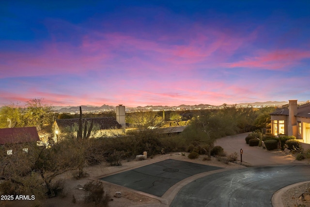 yard at dusk with a mountain view