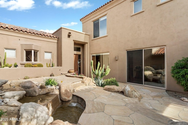 rear view of property with a patio area