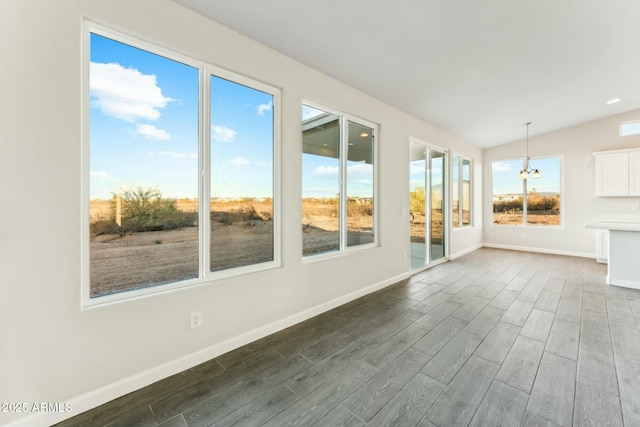 unfurnished sunroom featuring lofted ceiling