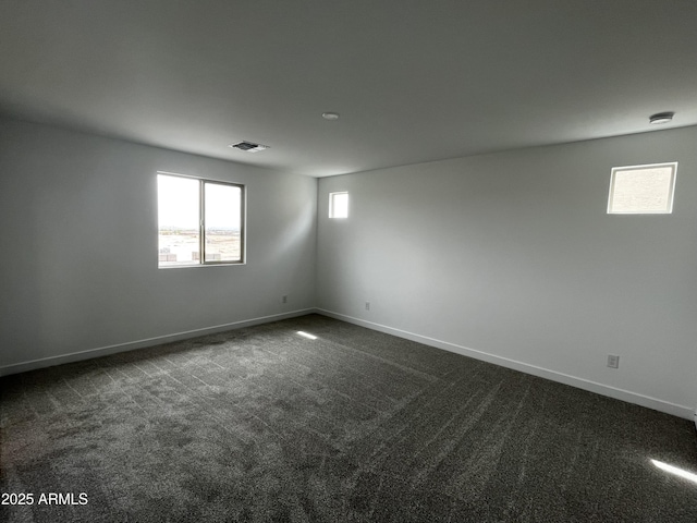 17481 W Fulton St, Goodyear, AZ 85338 - unfurnished room featuring baseboards and dark colored carpet