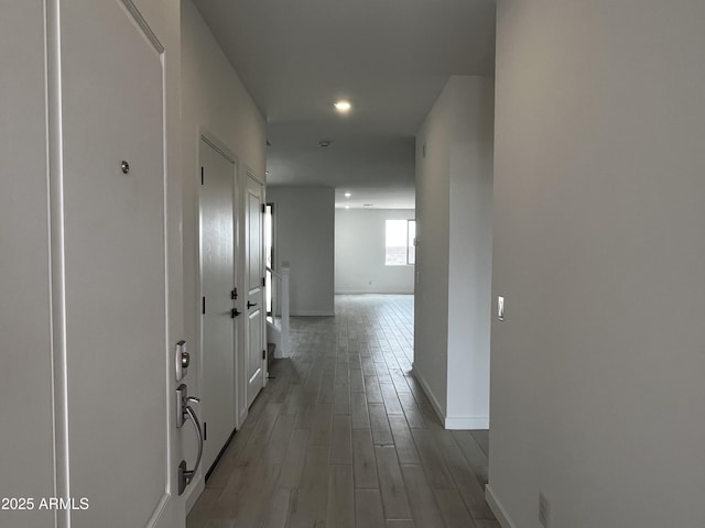17481 W Fulton St, Goodyear, AZ 85338 - hallway featuring baseboards, recessed lighting, and light wood-type flooring