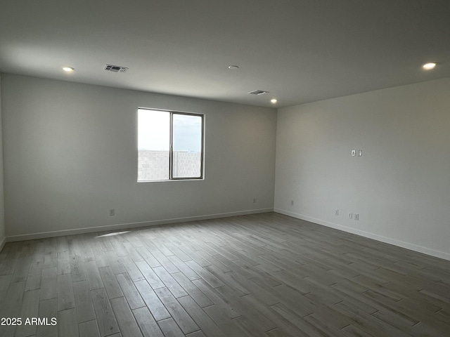 17481 W Fulton St, Goodyear, AZ 85338 - spare room featuring dark wood-style floors, recessed lighting, and baseboards