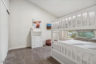 carpeted bedroom featuring vaulted ceiling