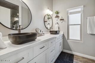 bathroom with vanity and wood-type flooring