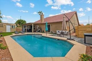 view of pool featuring a patio