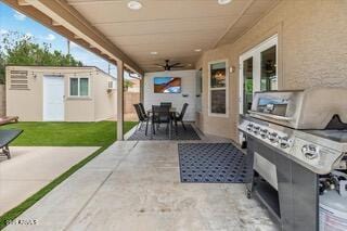 view of patio / terrace featuring an outbuilding and ceiling fan