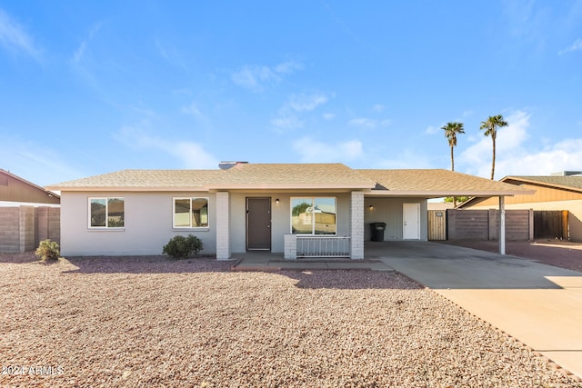 single story home with a carport