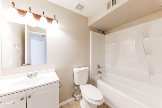 full bathroom featuring toilet, vanity,  shower combination, and tile patterned floors