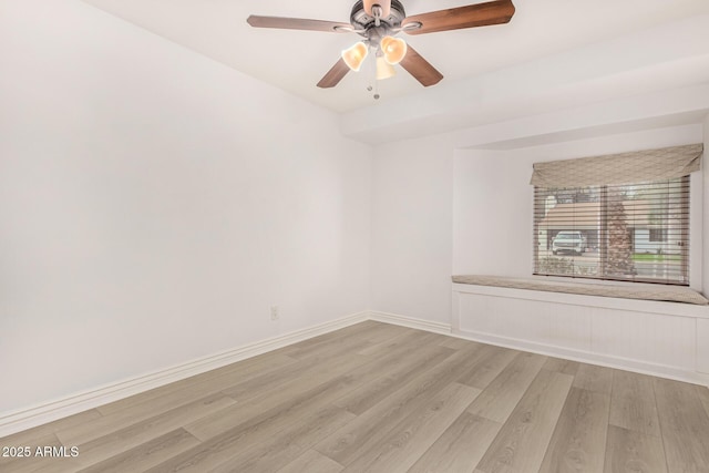 unfurnished room featuring ceiling fan and light wood-type flooring