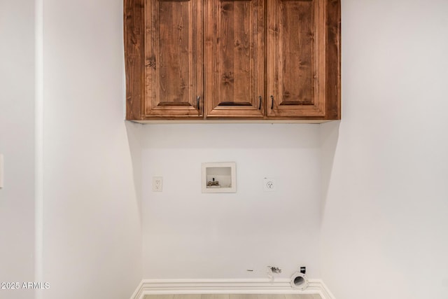 clothes washing area featuring hookup for an electric dryer, hookup for a gas dryer, cabinets, and hookup for a washing machine