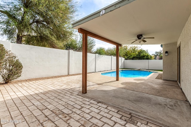 view of pool featuring ceiling fan and a patio