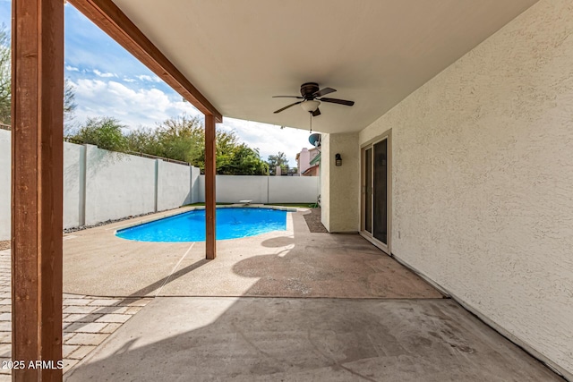 view of pool featuring ceiling fan and a patio area