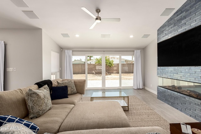 1513 S 108th Way, Chandler, AZ 85286 - living area with a ceiling fan, a fireplace, baseboards, and vaulted ceiling
