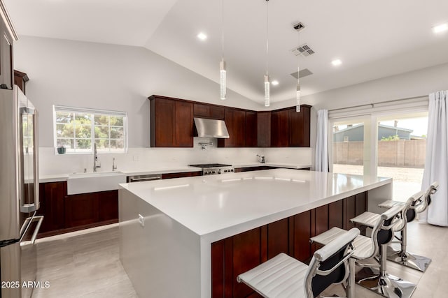 1513 S 108th Way, Chandler, AZ 85286 - kitchen featuring a sink, freestanding refrigerator, under cabinet range hood, vaulted ceiling, and light countertops