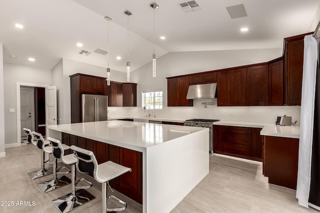 1513 S 108th Way, Chandler, AZ 85286 - kitchen with stainless steel appliances, ventilation hood, a large island, lofted ceiling, and decorative light fixtures