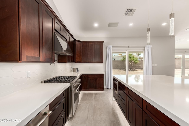 1513 S 108th Way, Chandler, AZ 85286 - kitchen featuring appliances with stainless steel finishes, under cabinet range hood, light countertops, decorative backsplash, and healthy amount of natural light