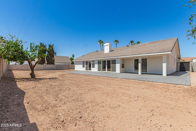 1513 S 108th Way, Chandler, AZ 85286 - rear view of house featuring a patio, a fenced backyard, a chimney, and a tiled roof