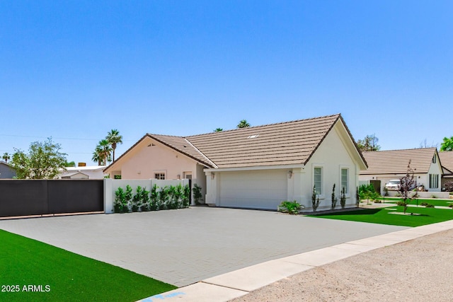 1513 S 108th Way, Chandler, AZ 85286 - view of front facade with stucco siding, an attached garage, decorative driveway, and a tiled roof