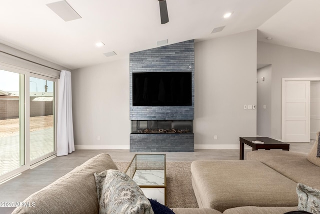1513 S 108th Way, Chandler, AZ 85286 - living room with lofted ceiling, a fireplace, a ceiling fan, wood finished floors, and baseboards