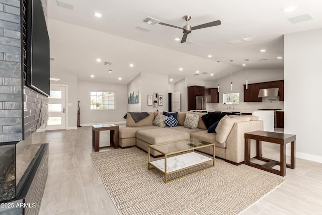1513 S 108th Way, Chandler, AZ 85286 - living room featuring plenty of natural light, lofted ceiling, a ceiling fan, baseboards, and recessed lighting