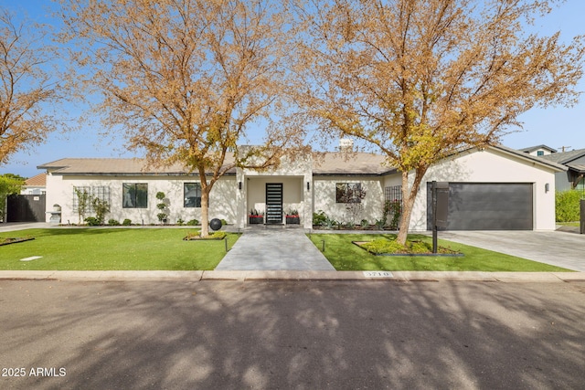 ranch-style home with a garage and a front lawn