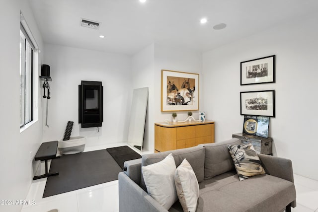 tiled living room with plenty of natural light