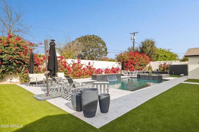 view of pool featuring a lawn, pool water feature, and a patio