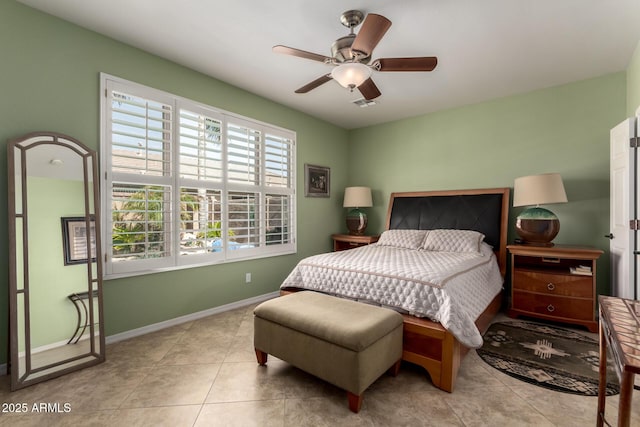 tiled bedroom with baseboards and ceiling fan