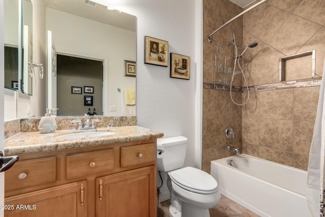 bathroom featuring vanity, toilet, and shower / tub combo