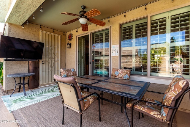 exterior space featuring outdoor dining space and a ceiling fan