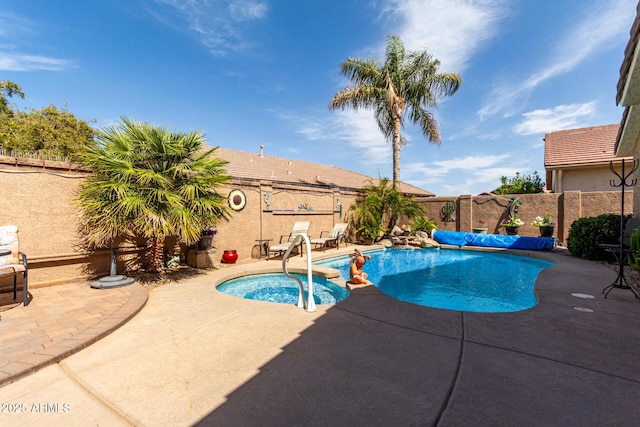 view of pool featuring a patio, a fenced backyard, a fenced in pool, and an in ground hot tub